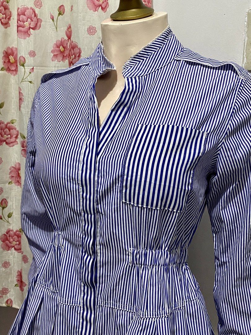Ovia blue stripe Dress (Category: Dresses) located in Binan City. Submitted by myutopia28 (Listing ID 1442624613, Image 2). Description: Size small to medium Model: OviaPattern: Blue and white vertical pinstripesDesign Features:Classic point collar with a full button-down front placketFitted, gathered elasticized waist panel for structured tailoringAsymmetric stripe orientation on the chest pocket and bottom skirt trimLong sleeves with structured