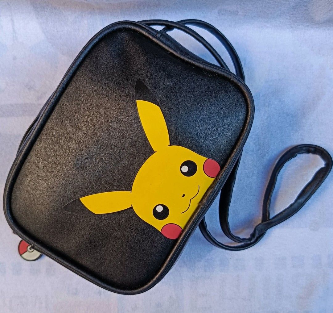 Pokemom Sling Bag, Pikachu (Category: Luxury Bags & Wallets) located in Baguio. Submitted by boxmania (Listing ID 1442651986, Image 1). Description: like new From HK/UK/Dubai/Canada or Japan Surplus Box What you see is what you get No return, no exchange (random item po nakukuha ng seller sa box).