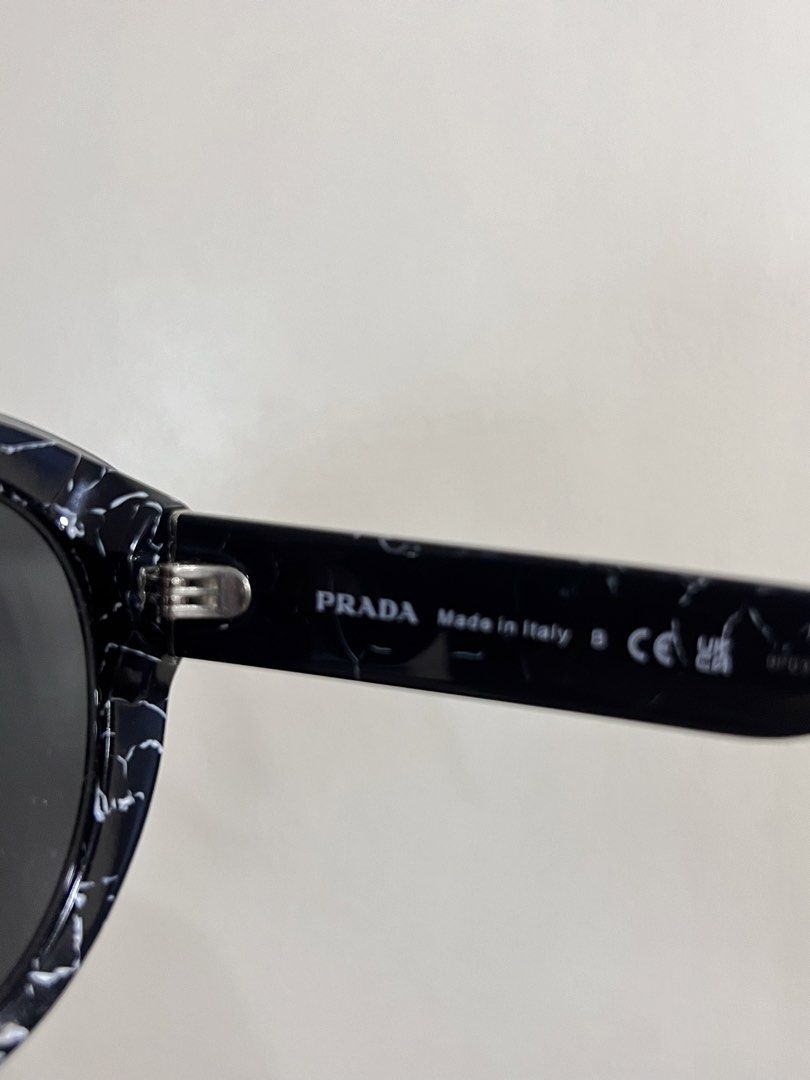 Prada Sunglasses Black Marble Pattern (Category: Sunglasses & Eyewear) located in Rizal. Submitted by ichaaay21 (Listing ID 1442667728, Image 3). Description: - Authentic Prada sunglasses - Stylish black frame with a unique marble pattern - Comes with original Prada case - Made in Italy - Bought in LA - Gently used, selling as is. -INCLUSIONS: HARD CASE ONLY! No more cleaning cloth.