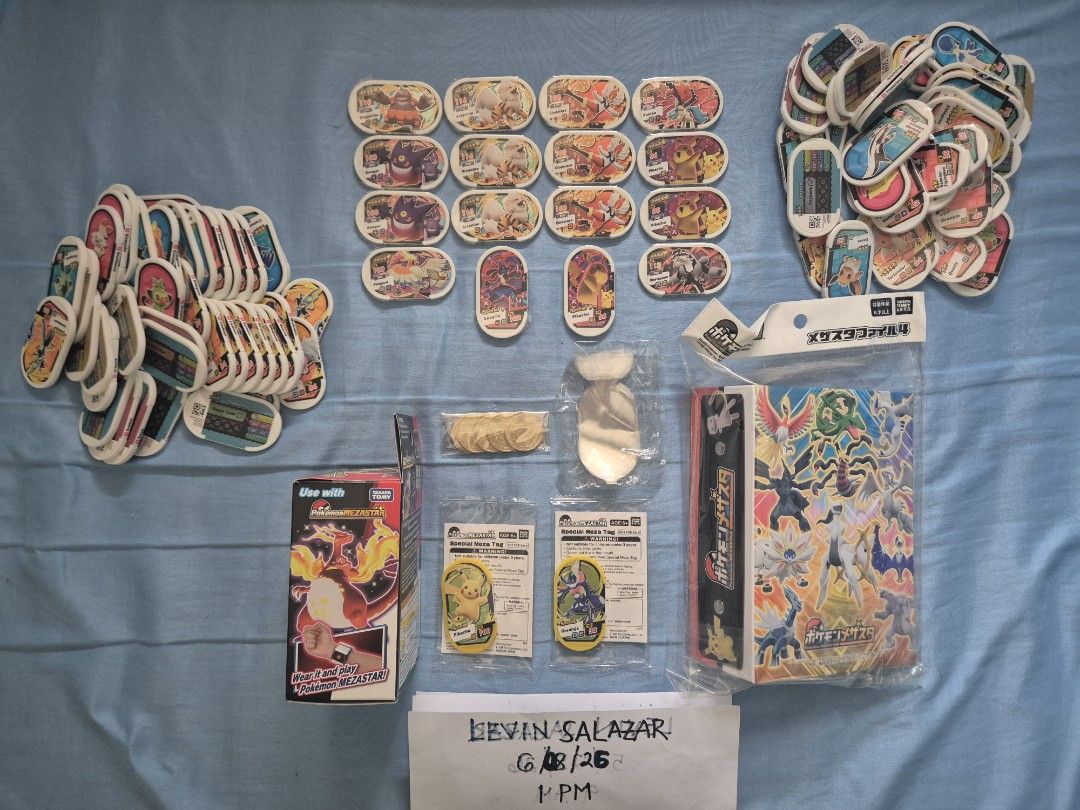 (SEALED) POKEMON MEZASTAR COLLECTION (Category: Raw Singles) located in Guiguinto. Submitted by Levinthings (Listing ID 1442594806, Image 3). Description: Quitting SALE: (Take ALL) Pokemon Mezastar Collection >Inclusions: - (2) Pikachu Event Pre-launch Hat - (COMPLETE) Event Pre-launch Starter Kit - (SEALED) File Album Version 4 - (SEALED) Charizard Dynamax Band - (Unused) Trainer ID card - Mimikyu Support card - (5) Tokens - (SEALED) Greninja Ev