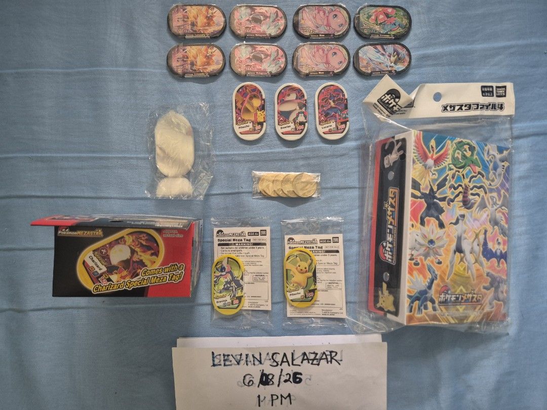 (SEALED) POKEMON MEZASTAR COLLECTION (Category: Raw Singles) located in Guiguinto. Submitted by Levinthings (Listing ID 1442594806, Image 2). Description: Quitting SALE: (Take ALL) Pokemon Mezastar Collection >Inclusions: - (2) Pikachu Event Pre-launch Hat - (COMPLETE) Event Pre-launch Starter Kit - (SEALED) File Album Version 4 - (SEALED) Charizard Dynamax Band - (Unused) Trainer ID card - Mimikyu Support card - (5) Tokens - (SEALED) Greninja Ev