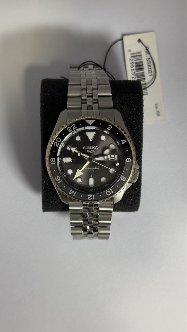 Seiko 5 GMT Automatic Watch SSK021 (Category: Men's Watches) located in Manila. Submitted by vallaurence (Listing ID 1442713784, Image 2). Description: - Seiko 5 GMT Automatic Watch - Stainless steel case and bracelet - Black dial with gold bezel accents - Date window - GMT function for dual time zones - 10 Bar Water Resistance (100 meters) - Made in Japan - 24 Jewels - Exhibition case back to view movement.