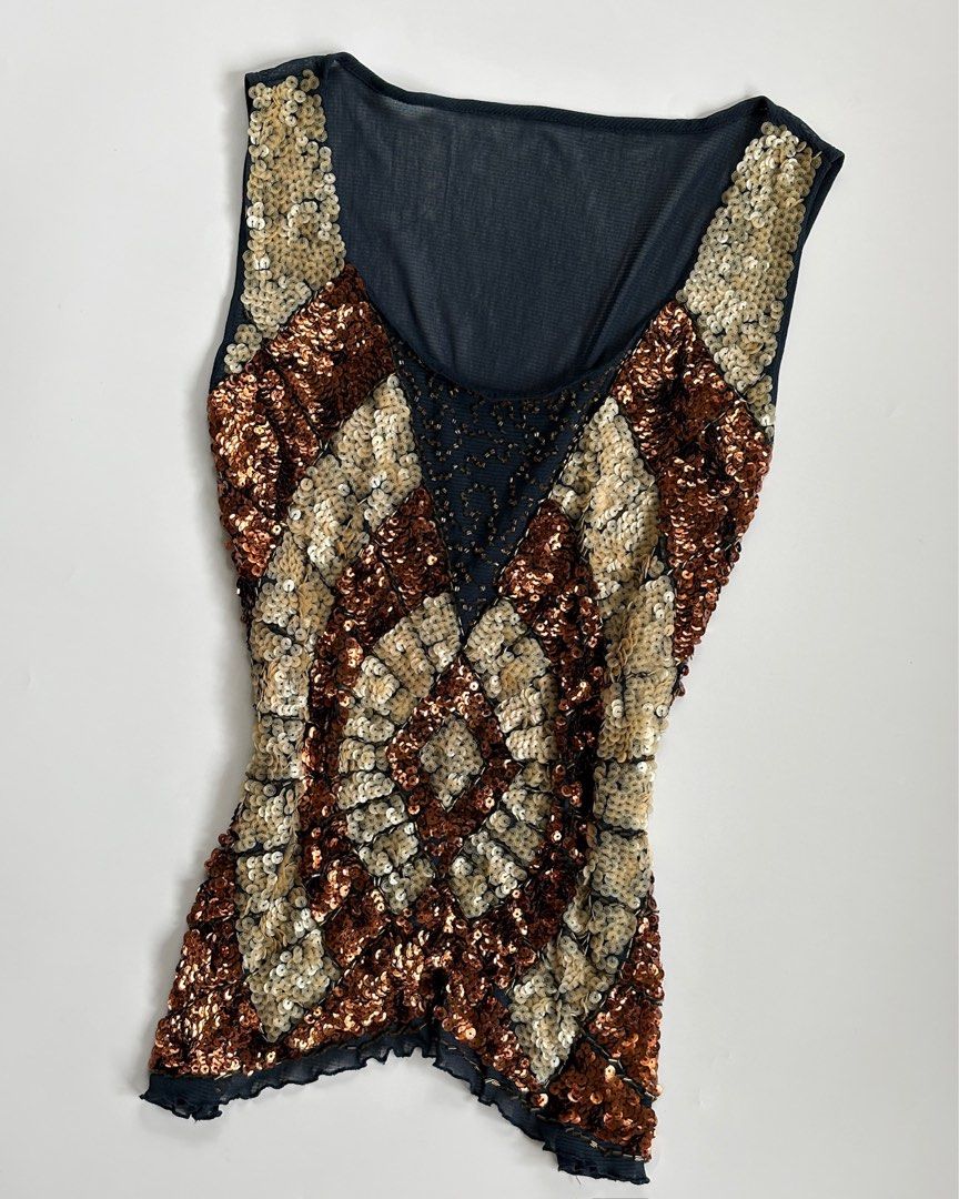 Sparkly Beaded Tank Top - Bronze & Gold (Category: Sleeveless) located in Tarlac. Submitted by kr_closet (Listing ID 1442727167, Image 2). Description: - Eye-catching bronze and gold sequins in a diamond pattern - Flattering V-neckline - Sleeveless design - Sheer black fabric on upper chest and back for a touch of allure - Trendy lettuce hem detail - Ideal for parties, nights out, or any special occasion.