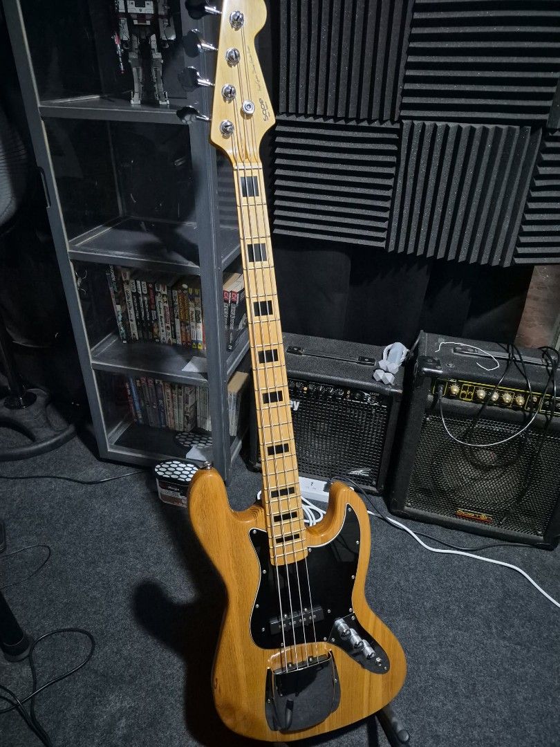 SQOE Jazz Bass Guitar - Natural Finish (Category: Musical Instruments) located in Manila. Submitted by horrorguy (Listing ID 1442704364, Image 1). Description: Specification -body material: solid wood often poplar or basswood depending on the specific production run) -neck material: maple -neck shape: modern "C" shape -fingerboard: rosewood -number of frets: 20 medium jumbo -scale lenght: 34 standard long scale -nut width: 38mm (1.5") -pickups: 2