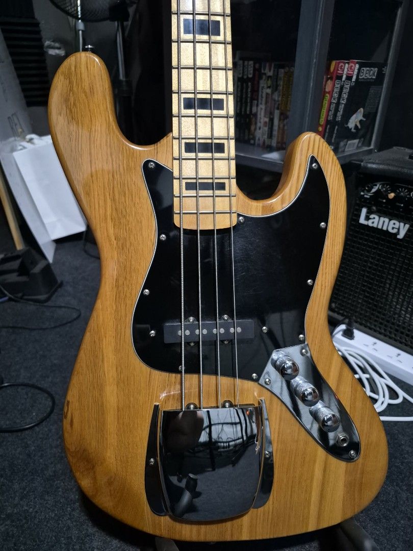 SQOE Jazz Bass Guitar - Natural Finish (Category: Musical Instruments) located in Manila. Submitted by horrorguy (Listing ID 1442704364, Image 3). Description: Specification -body material: solid wood often poplar or basswood depending on the specific production run) -neck material: maple -neck shape: modern "C" shape -fingerboard: rosewood -number of frets: 20 medium jumbo -scale lenght: 34 standard long scale -nut width: 38mm (1.5") -pickups: 2