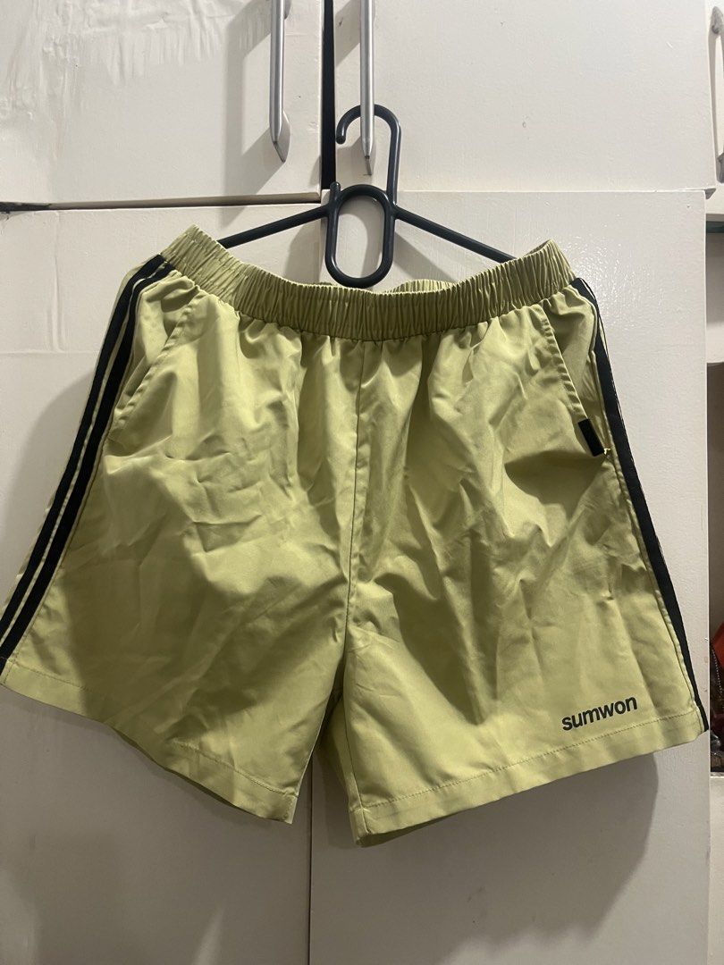 Sumwon Shorts Size S Light Green with Black Stripes (Category: Shorts) located in Cagayan de Oro. Submitted by everythingpreloved__ (Listing ID 1442688311, Image 1). Description: - Brand: Sumwon - Color: Light Green - Stripes: Black on sides - Waistband: Elastic for comfort - Pockets: Two side pockets - Size: S - Origin: Made in China - Ideal for: Casual wear or sports.