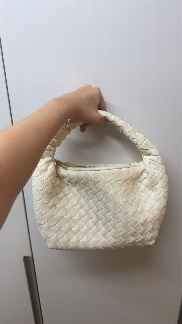Target White Woven Knot Handle Hand Bag (Category: Shoulder Bags) located in Paranaque City. Submitted by migvee (Listing ID 1442565351, Image 3). Description: - Stylish white shoulder bag - Unique woven texture - Trendy knotted handle - Secure zip closure - Ideal for everyday use - Fits your phone, wallet, and keys - Versatile and easy to match with any outfit.