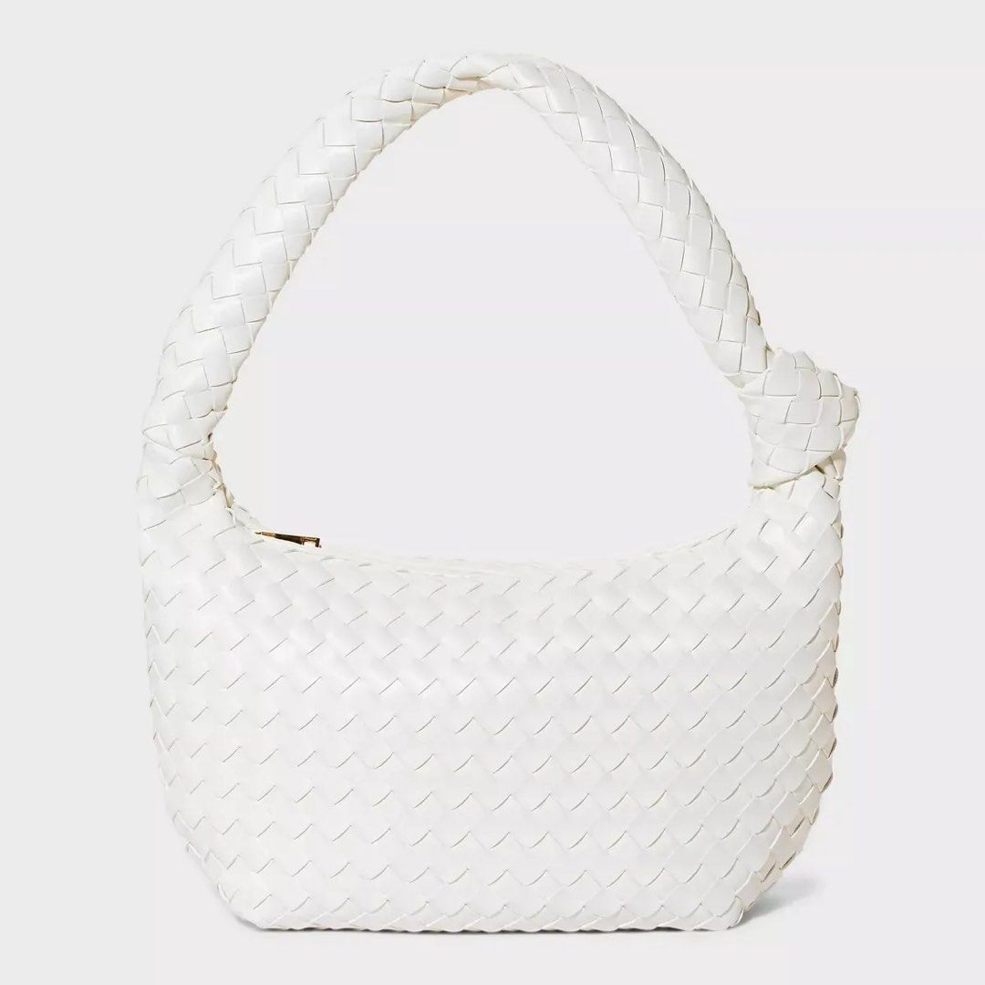 Target White Woven Knot Handle Hand Bag (Category: Shoulder Bags) located in Paranaque City. Submitted by migvee (Listing ID 1442565351, Image 1). Description: - Stylish white shoulder bag - Unique woven texture - Trendy knotted handle - Secure zip closure - Ideal for everyday use - Fits your phone, wallet, and keys - Versatile and easy to match with any outfit.