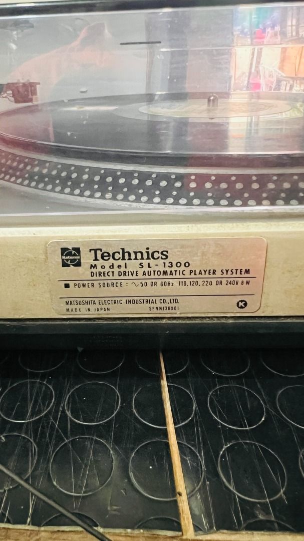 Technics SL-1300 Vintage Turntable (1974) (Category: Other Audio Equipment) located in Baguio. Submitted by mystic.mt (Listing ID 1442634853, Image 3). Description: FOR SALE: Technics SL-1300 (1974) A golden-era, collector-grade Japanese deck offering the legendary direct-drive performance of the SL-1200 family with the premium convenience of a fully automatic system. Ready to plug and play. Note: There is a clean sticker covering a circular heat