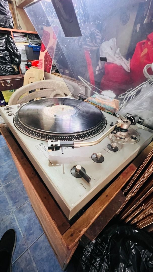 Technics SL-1300 Vintage Turntable (1974) (Category: Other Audio Equipment) located in Baguio. Submitted by mystic.mt (Listing ID 1442634853, Image 2). Description: FOR SALE: Technics SL-1300 (1974) A golden-era, collector-grade Japanese deck offering the legendary direct-drive performance of the SL-1200 family with the premium convenience of a fully automatic system. Ready to plug and play. Note: There is a clean sticker covering a circular heat