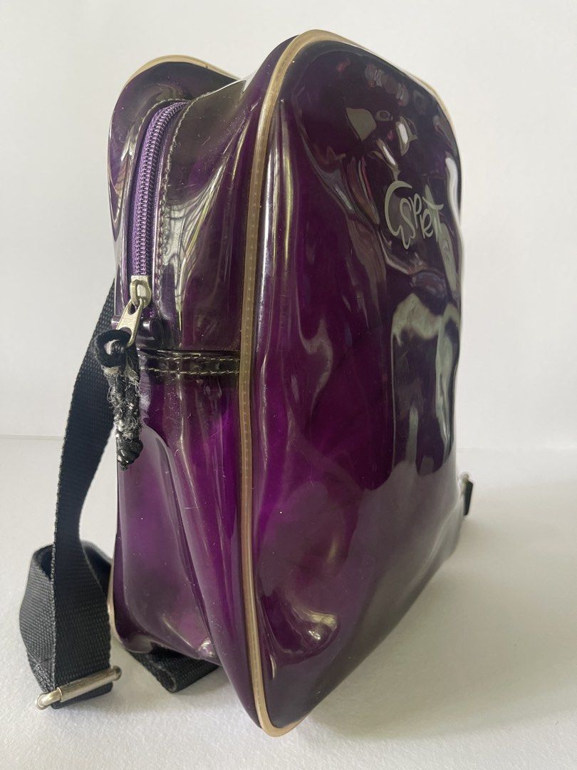 Vintage Y2K Esprit Purple Patent Mini Backpack (Category: Backpacks) located in Lucena. Submitted by secondspinph (Listing ID 1442557107, Image 2). Description: - Cute mini backpack from Esprit from the late ‘90s (personally used, pasalubong from the US) - Shiny purple patent pvc material - Adjustable straps - Front zip closure - Small size, perfect for essentials - Shows some wear on zipper pull and straps - willing to send additional pics/vids,