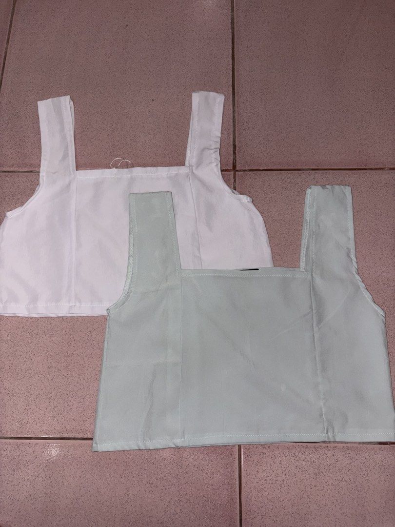 White and Mint Green Square Neck Crop Tops (Category: Blouses) located in Manila. Submitted by preciousgene (Listing ID 1442615845, Image 1). Description: - Two cute crop tops: one white, one soft mint green. - Features a stylish square neckline. - Simple and chic strap details. - Versatile for layering or wearing solo. - Effortlessly matches with any bottoms. - Ideal for casual everyday wear..