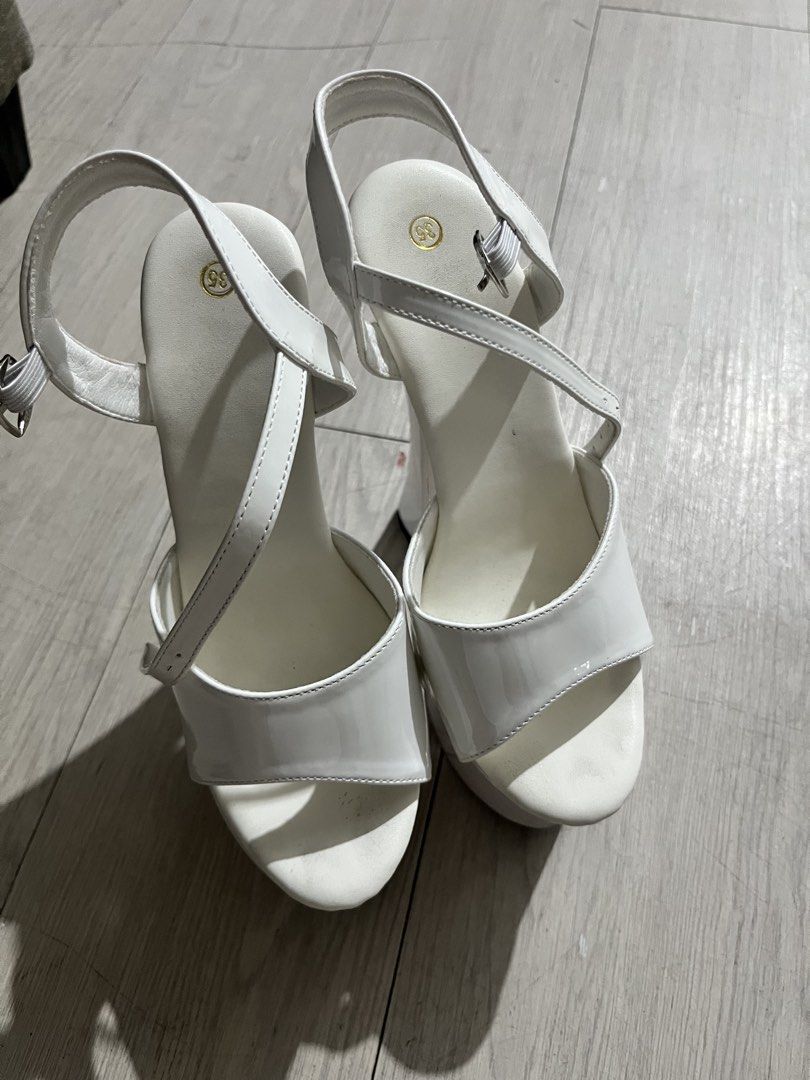 White Patent Platform Heels with Clear Block Heel (Category: Heels) located in Quezon City. Submitted by jjpcloset (Listing ID 1442699768, Image 1). Description: - White patent pageant heels - Bought for 3k in orange app - Features a clear block heel - Includes an ankle strap - Size 35 / 22cm - 6.5 inches heel height - Ideal for pageants or weddings.