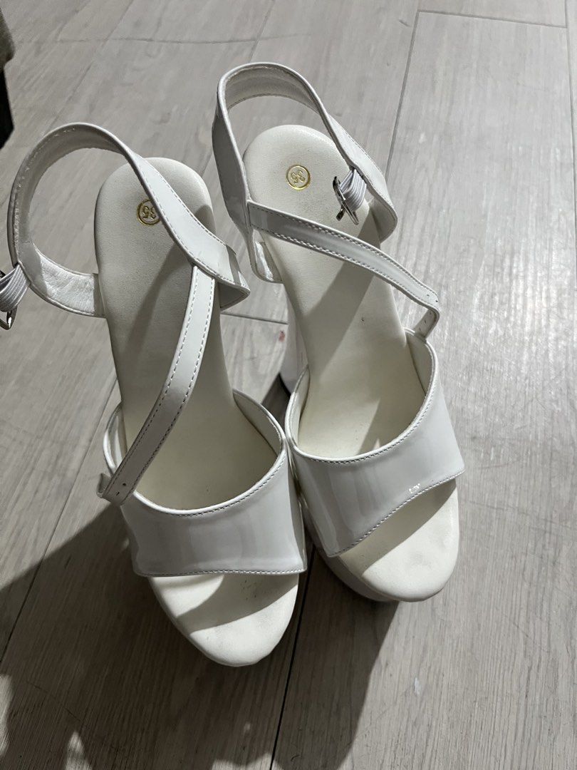 White Patent Platform Heels with Clear Block Heel (Category: Heels) located in Quezon City. Submitted by jjpcloset (Listing ID 1442699768, Image 3). Description: - White patent pageant heels - Bought for 3k in orange app - Features a clear block heel - Includes an ankle strap - Size 35 / 22cm - 6.5 inches heel height - Ideal for pageants or weddings.