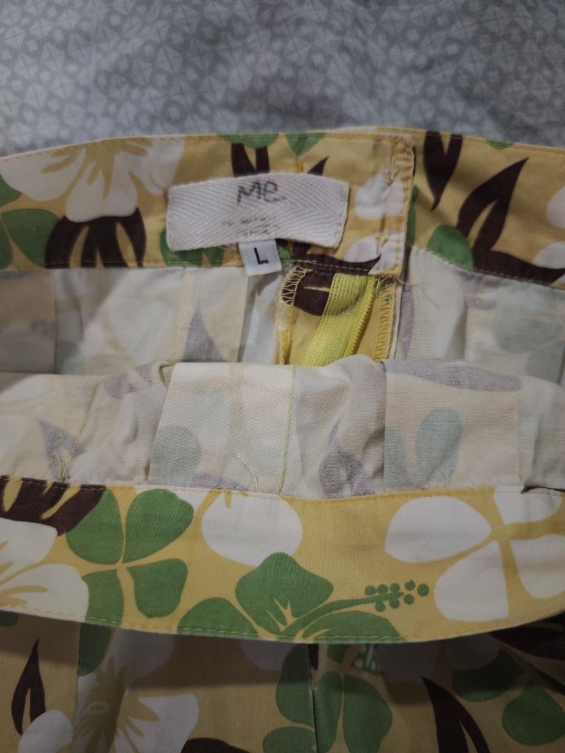 Yellow Floral Skirt (Category: Skirts) located in Quezon City. Submitted by declutteringmami (Listing ID 1442543003, Image 2). Description: - Yellow midi skirt with green & white floral print - Size: L but I had it altered to fit Small frames - Features pleats all around - Side zipper closure - Ideal for casual wear or a tropical vibe.