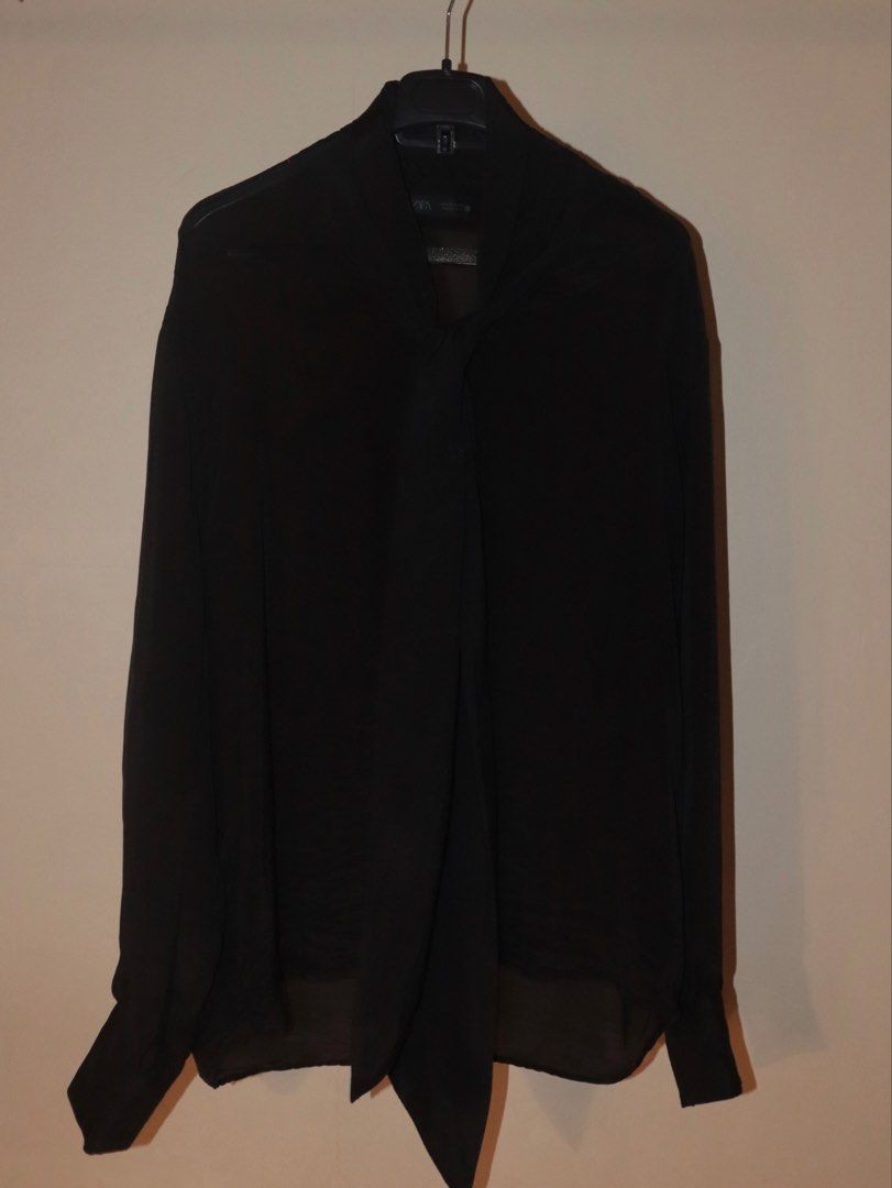 Zara Black Long Sleeve with Bow (Category: Formal Shirts) located in Manila. Submitted by ar_archives (Listing ID 1442711304, Image 2). Description: - Zara black blouse - Size S - Elegant tie-neck detail - Long sleeves with button cuffs - Sheer fabric at the hem - Perfect for dressing up or down - BRAND NEW, NEVER WORN.