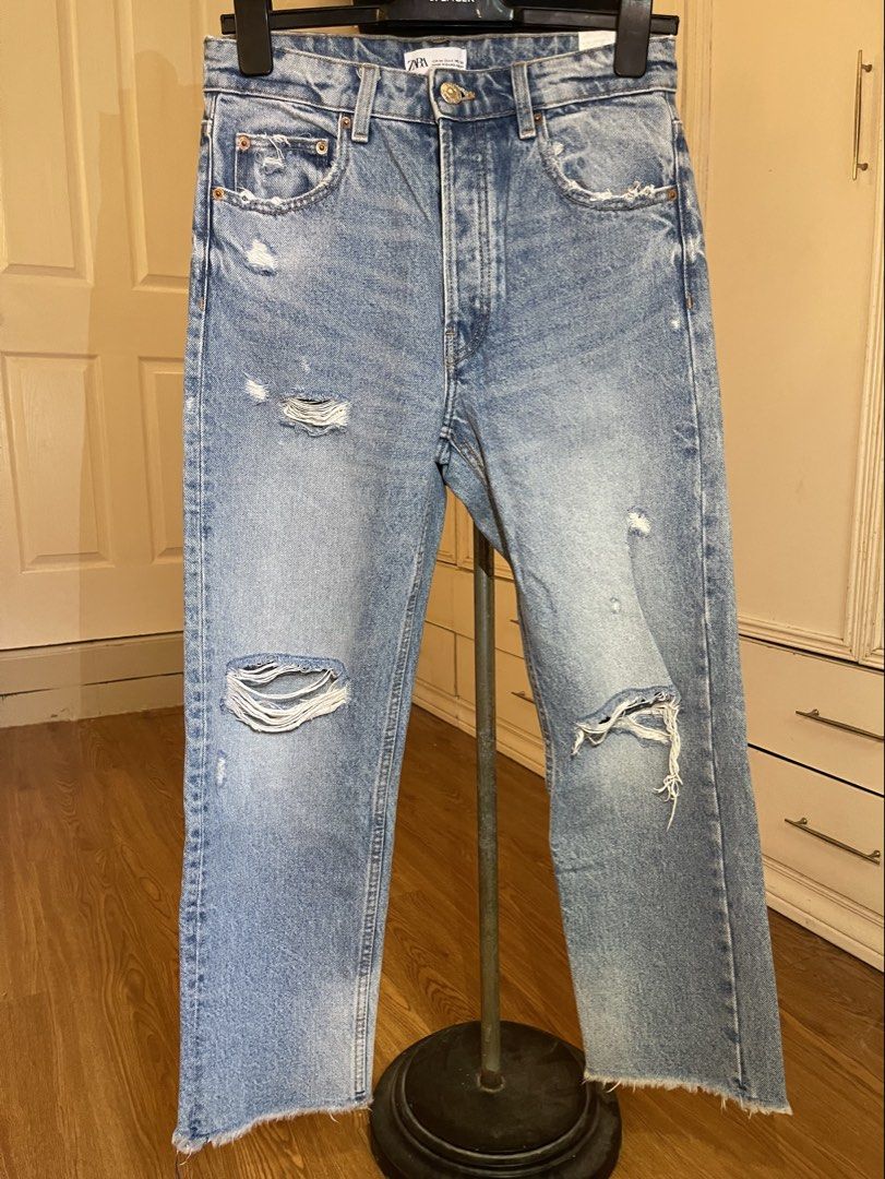 ZARA lightwash distressed denim jeans (Category: Jeans) located in Cebu City. Submitted by nerine888 (Listing ID 1442447209, Image 1). Description: Great casual pair of jeans. Used a few times and still like it's good as new Button Fly/Multi-button (not zipper) Please see pics for measurements.