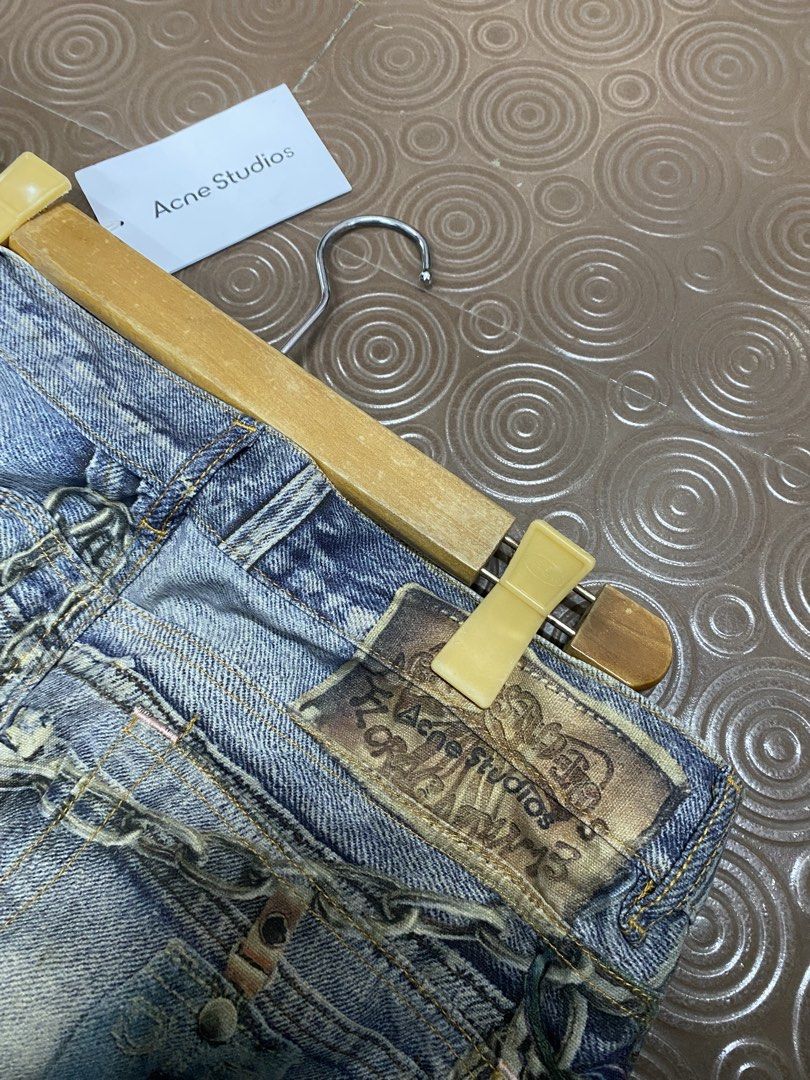 Acne Studios Distressed Denim Jeans with Chains (Category: Jeans) located in Balanga. Submitted by vincentyy697259 (Listing ID 1442870733, Image 2). Description: - Acne Studios wide leg jeans - Distressed wash with paint splatters - Embellished with chains and charms - Size: EUR 32 (CN 195/92A) - Unique statement piece.