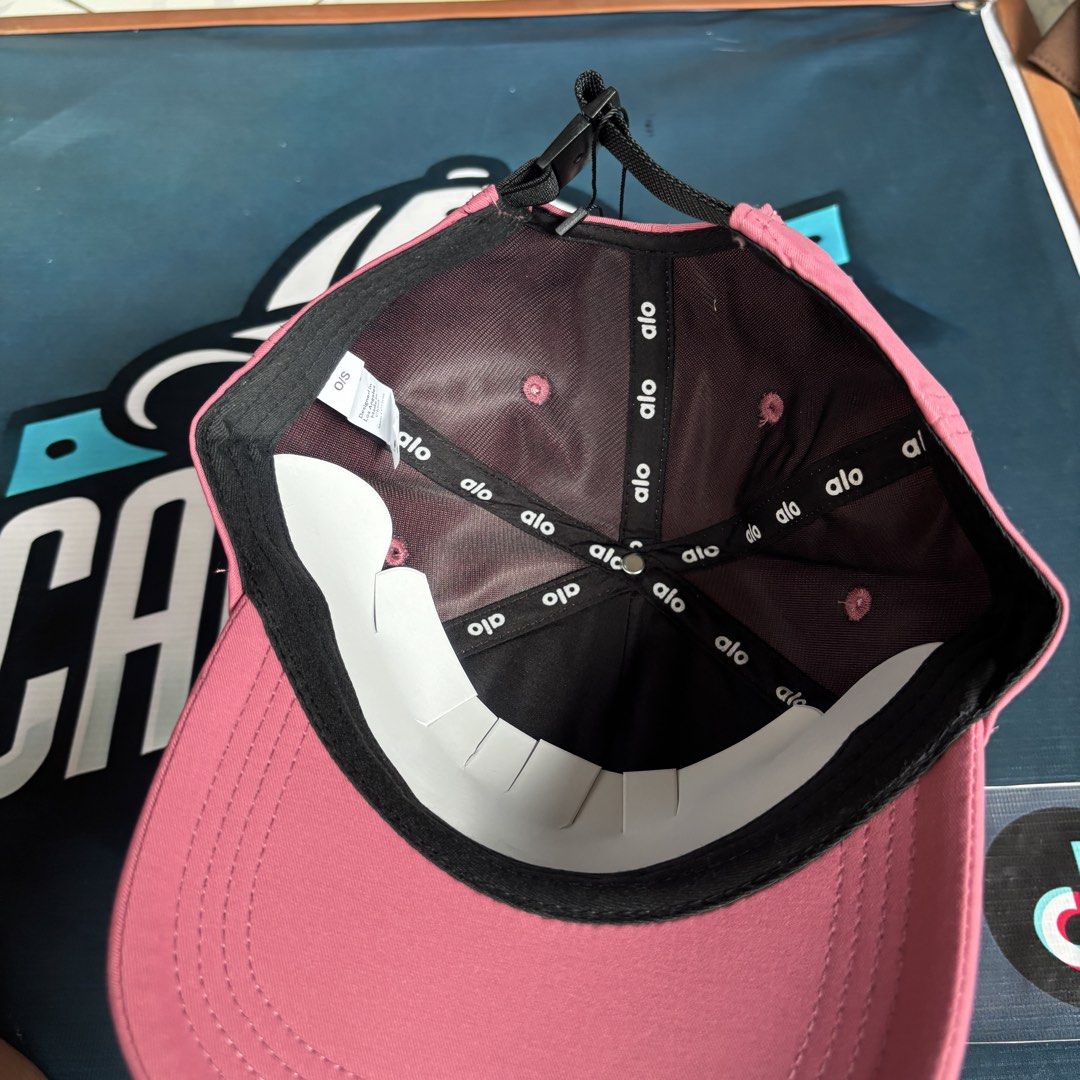 Alo Yoga Pink Baseball Cap (Category: Caps & Hats) located in Balagtas. Submitted by capspree (Listing ID 1442802933, Image 3). Description: - Brand new Pink Alo Yoga cap - Comes with tags attached - Adjustable strap for a perfect fit - Embroidered Alo Yoga logo on the front - Ideal for everyday wear and workouts.