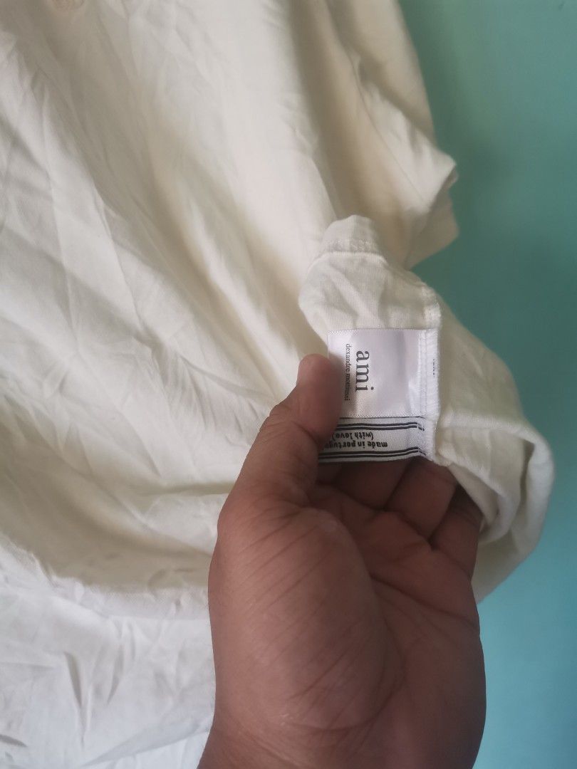 AMI Paris T-shirt Cream (Category: Tshirts & Polo Shirts ) located in Cabanatuan. Submitted by chinithou (Listing ID 1442813631, Image 3). Description: - Cream colored AMI Paris t-shirt - Basic, classic design - Ideal for everyday wear - Please check photos for detailed condition.