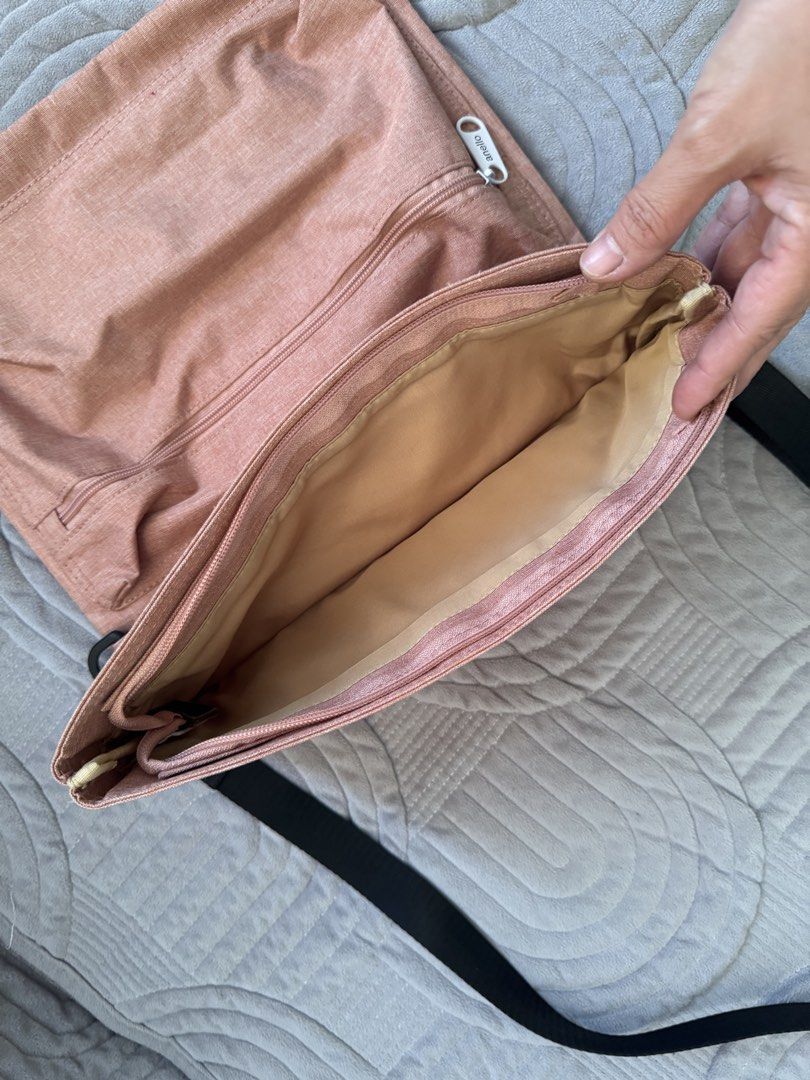 Anello Crossbody Bag Peach Pink (Category: Cross-body Bags) located in Makati City. Submitted by ehya_est (Listing ID 1442921945, Image 3). Description: - Anello crossbody bag - Lovely peach pink color - Main compartment for storage - Front pocket for quick access - Adjustable strap for comfort - Ideal for everyday use Location: Taguig - Spacious interior for essentials - Clean and simple design.