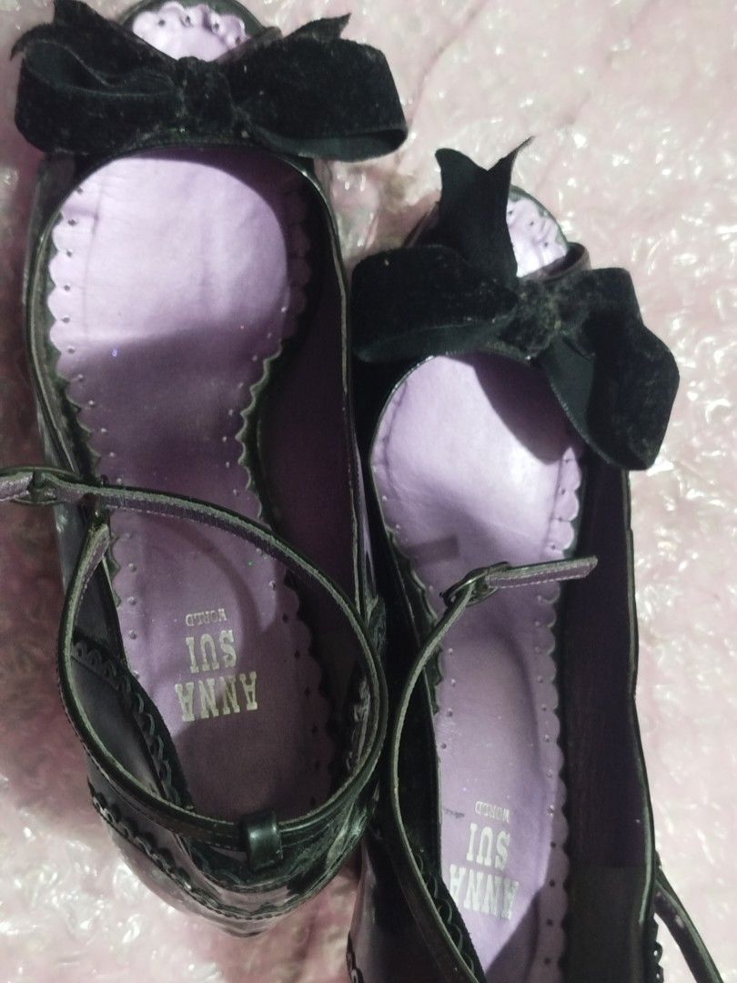 Anna Sui Black Patent Heels with Velvet Bows (Category: Heels) located in Caloocan City. Submitted by sunrizel (Listing ID 1441284018, Image 2). Description: Anna Sui black patent leather Mary Jane heels with a velvet bow and ankle strap. (Bows are pitch black irl, they just look weird on the first pic). Features a purple scalloped lining. Perfect for dressing up! Bought on Carousell a year ago, I've worn this only once indoors as I'm one size do
