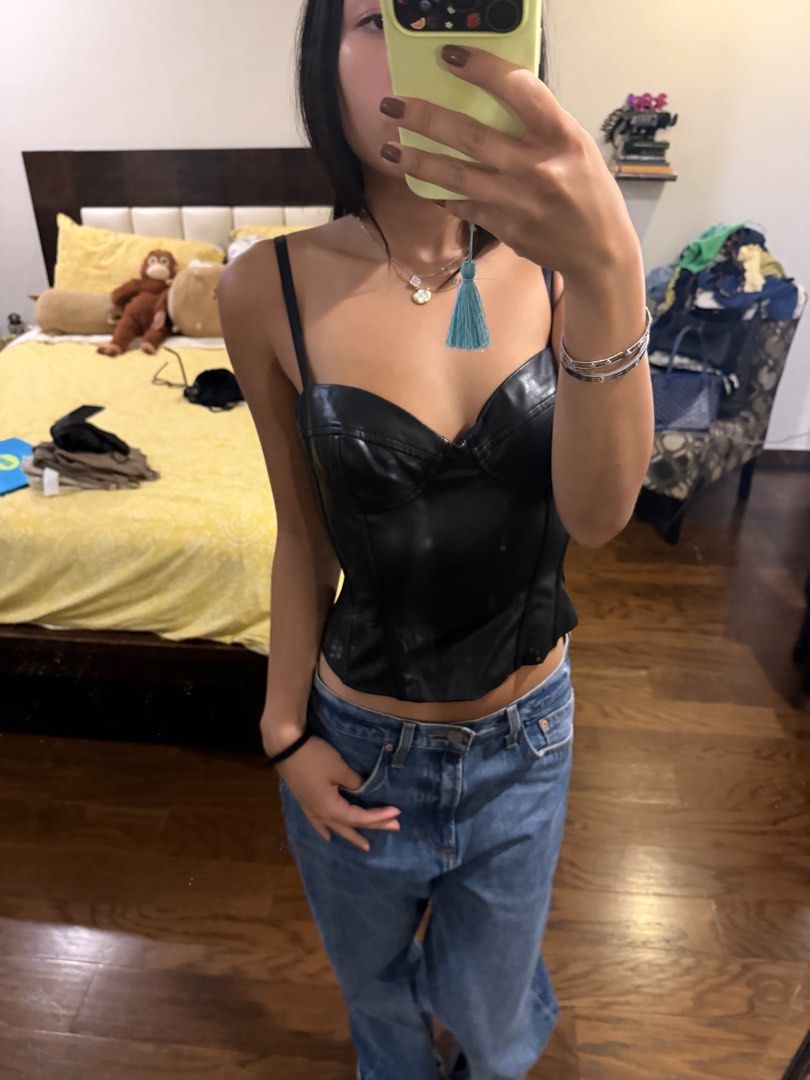 Aritzia Black Leather Corset Top with Straps (Category: Sleeveless) located in Paranaque City. Submitted by bbbcloset (Listing ID 1442849289, Image 3). Description: - bought for 140 USD (9k) - Black faux leather corset top - Sweetheart neckline with adjustable straps - Fitted bodice with boning detail - Flattering silhouette - Pairs well with jeans or skirts - Ideal for nights out or elevating any outfit.
