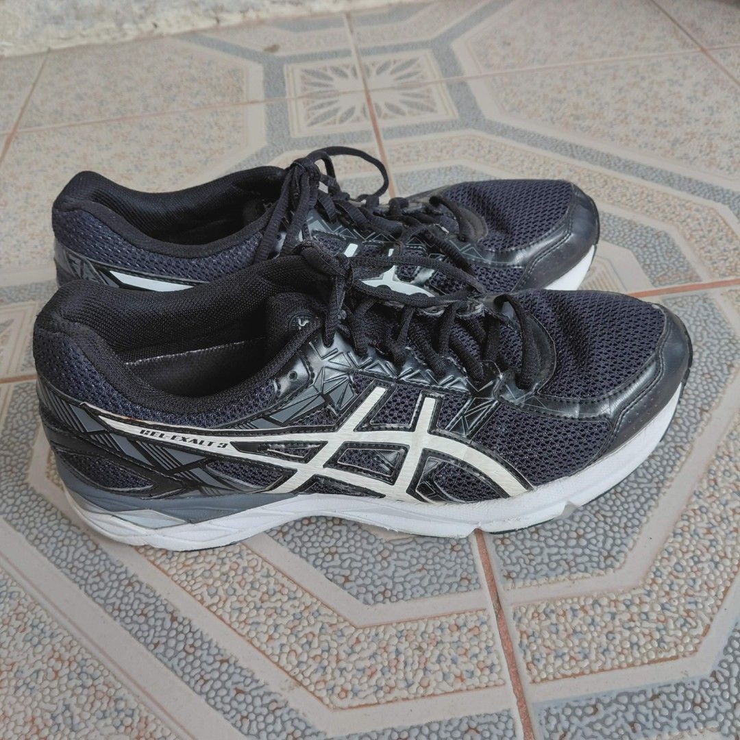 ASICS GEL-EXALT 3 Running Shoes (Category: Sneakers) located in Danao, Cebu. Submitted by thriftmini88932 (Listing ID 1442732357, Image 3). Description: - ASICS GEL-EXALT 3 running shoes - Color: Dark blue with white accents - Features breathable mesh upper - Ideal for running or everyday wear - Soles show some wear, but plenty of life remaining - Please check photos for detailed condition.
