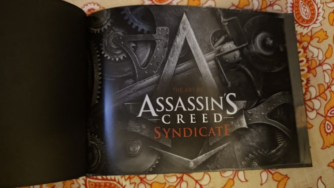 Assassin's Creed Syndicate Artbook (Category: Storybooks) located in Quezon City. Submitted by cheems_ (Listing ID 1442743679, Image 2). Description: for sale assassin's creed syndicate artbook in excellent mint condition loc: pasig shipping care of buyer pm if interested .