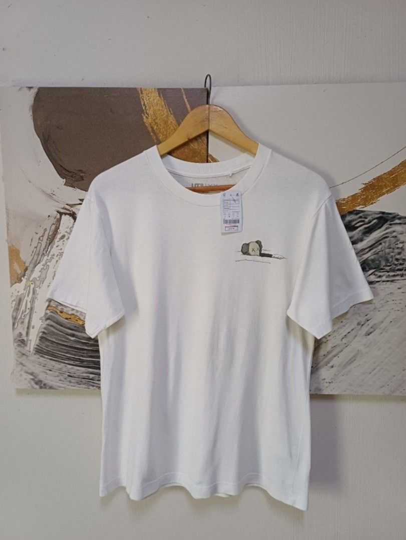 AUTHENTIC UNIQLO KAWS UNISEX SHIRT (Category: Activewear) located in Manila. Submitted by bvnnie (Listing ID 1442648376, Image 3). Description: Actual size using inches Armpit to Armpit/ 20.5 Lenght/27 fittings is Large Women, Medium in men Excellent Condition, Issue:0 Message if you have any other question about sizing. We do shipping nation wide I'm also open for video call so that you can see the item you 're interested to buy. Courier, DHL, J