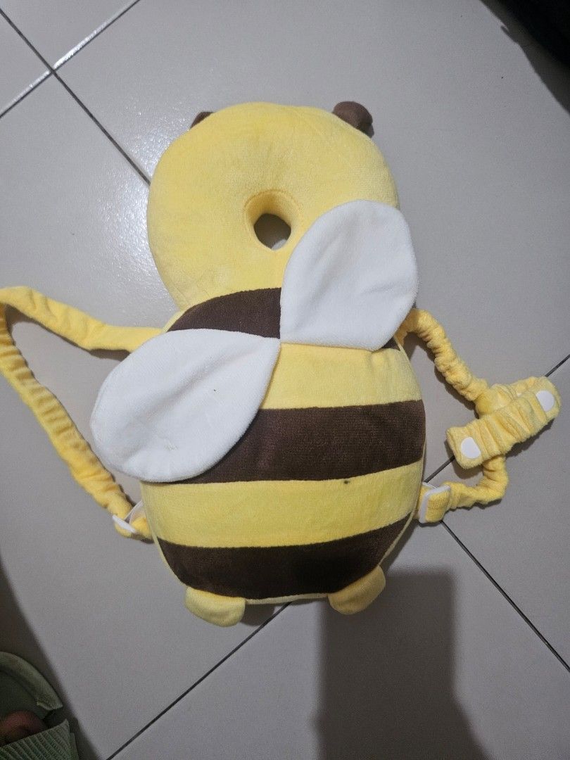 Baby Head Protector Safety Pad Cushion Backpack Bee Design (Category: Other Babies Going Out Needs) located in Balungao. Submitted by k.dee (Listing ID 1442805709, Image 2). Description: - Adorable bee design for your little one. - Essential head protection for babies learning to walk or crawl. - Made with soft and comfortable materials for maximum comfort. - Features adjustable straps to ensure a secure and perfect fit. - Effectively prevents co
