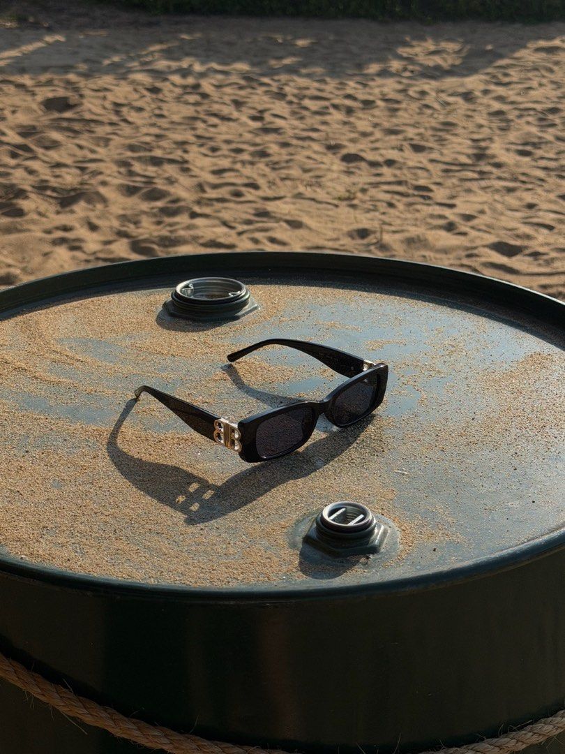 Balenciaga BB Logo Sunglasses Black (Category: Sunglasses & Eyewear) located in Manila. Submitted by urbanglasses.mnl (Listing ID 1442913216, Image 3). Description: - Features Gold BB Logo on Sides - Made in Italy - Rectangular Frame Shape - Ideal for Sunny Days - Versatile Accessory for Any Outfit.