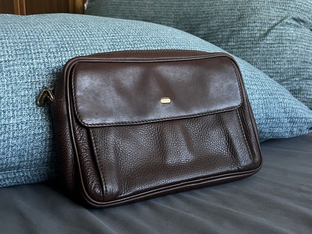 Bally Brown Leather Clutch Bag (Category: Luxury Bags & Wallets) located in Mandaluyong City. Submitted by thincrustpizza123 (Listing ID 1442796553, Image 1). Description: - brown pebbled leather - classic, timeless look - Main compartment with zip closure - Interior zip and slip pockets - Small exterior zip pocket on the back - Gold tone hardware - Ideal for carrying essentials - purchased at an invite-only vintage sale in Hong Kong - condition: