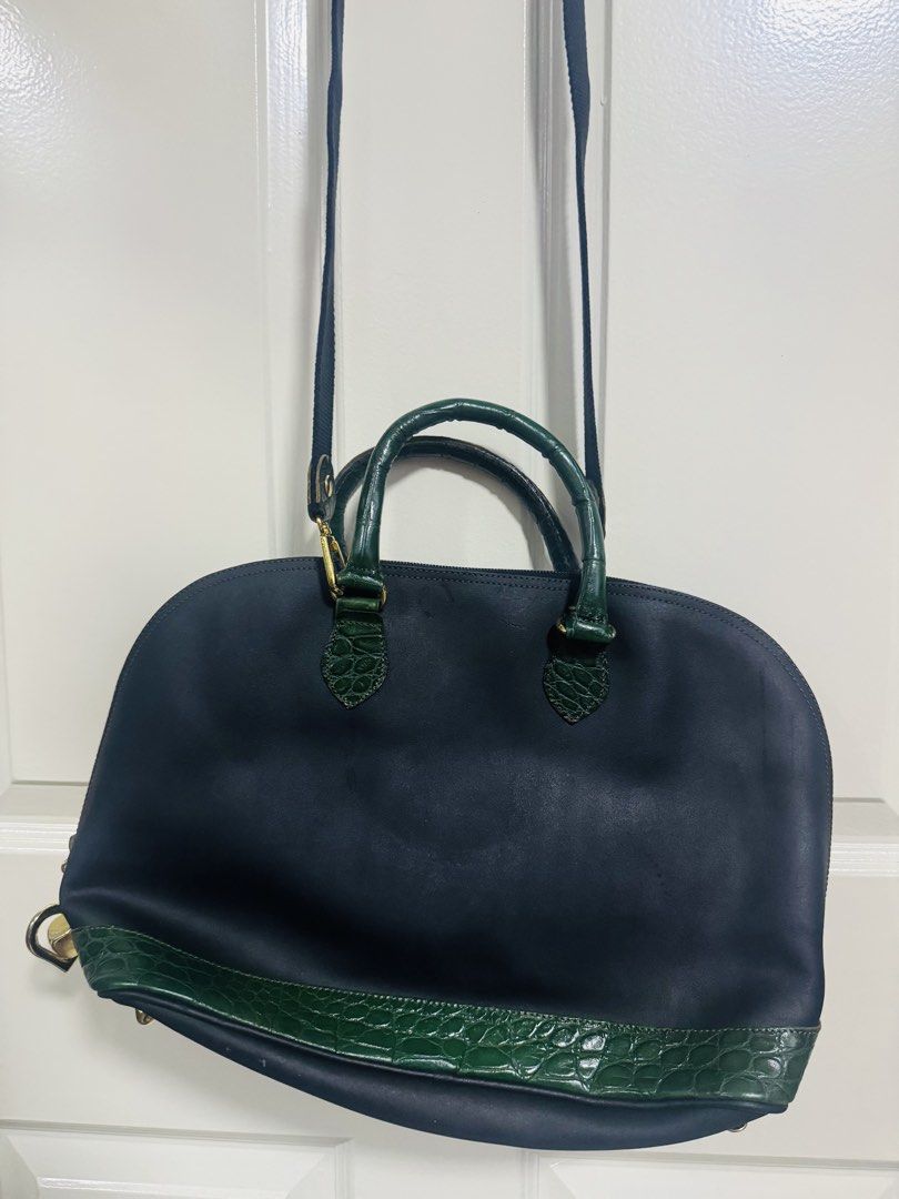 BLack & Green Crocodile Trim Dome Handbag (Category: Shoulder Bags) located in Quezon City. Submitted by TGDL123 (Listing ID 1442882687, Image 1). Description: - Navy blue dome handbag - Green crocodile trim on bottom and handles - Gold hardware - Heart and square charms - Detachable shoulder strap - Zipper closure -Made in Italy.