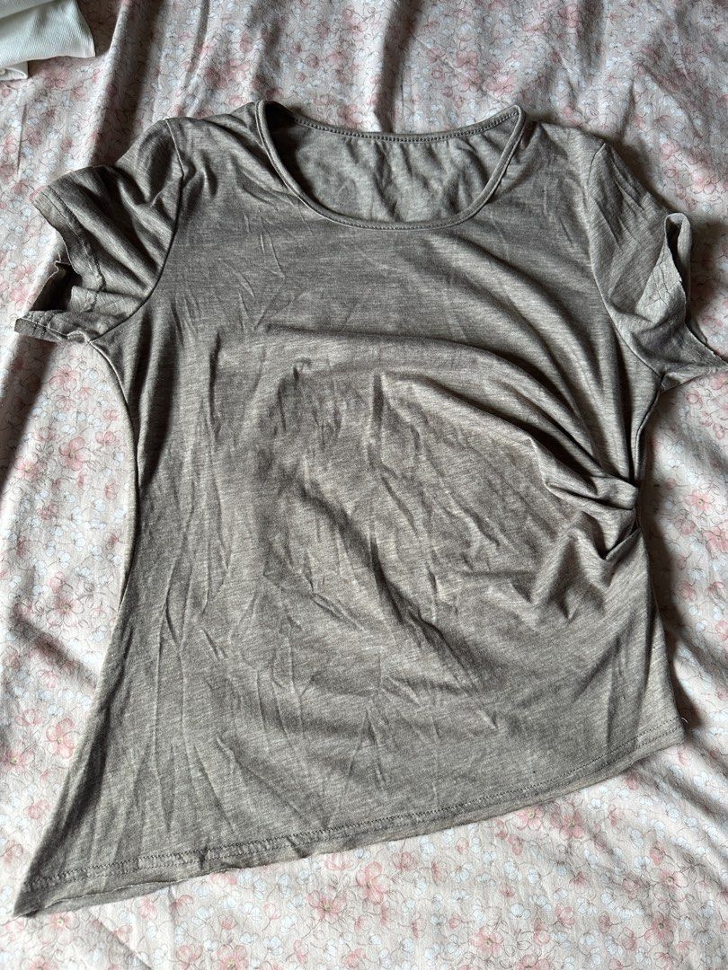 Brown Grey Taupe tshirt with Unique Back Graphic (Category: Shirts) located in Quezon City. Submitted by declutter_incorporated (Listing ID 1442792077, Image 1). Description: - brownish taupe t-shirt - Unique intricate graphic design on the back - Subtle ruched detail on the side front - Short sleeves - Rounded neckline - Asymmetrical hemline (lower on one side) - Comfortable and stylish top.