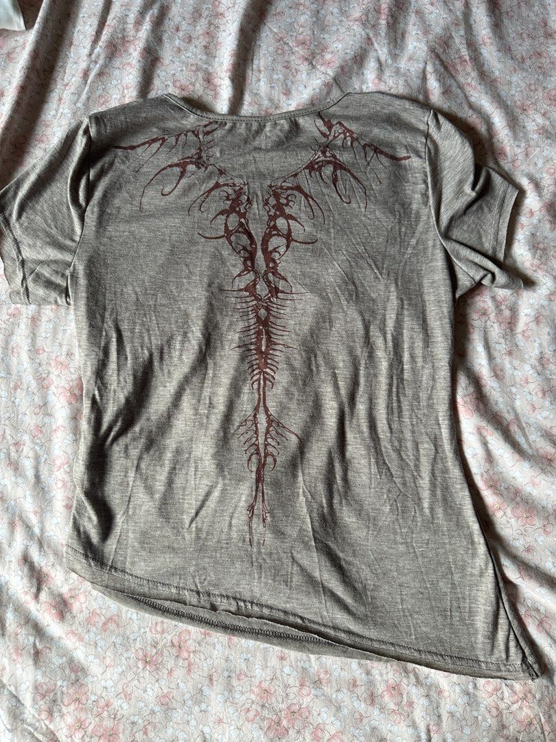 Brown Grey Taupe tshirt with Unique Back Graphic (Category: Shirts) located in Quezon City. Submitted by declutter_incorporated (Listing ID 1442792077, Image 2). Description: - brownish taupe t-shirt - Unique intricate graphic design on the back - Subtle ruched detail on the side front - Short sleeves - Rounded neckline - Asymmetrical hemline (lower on one side) - Comfortable and stylish top.