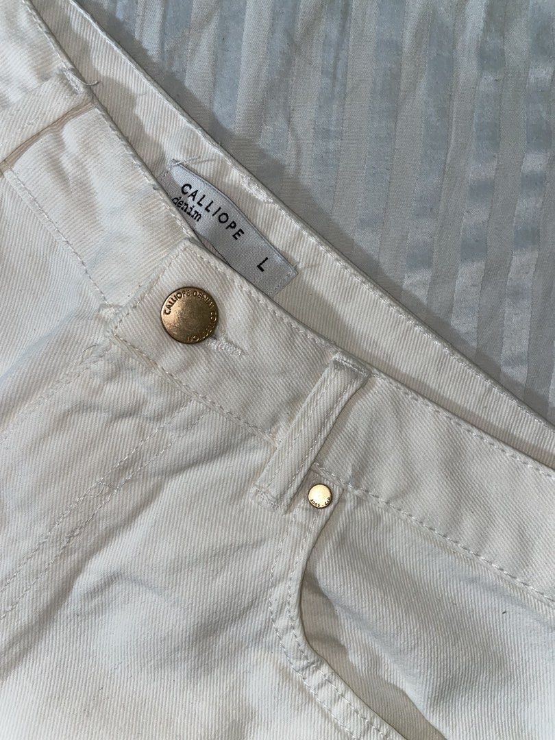 Calliope Denim White Mini Skirt Size L (Category: Skirts) located in Manila. Submitted by truestone_9580c8 (Listing ID 1442860877, Image 2). Description: - Brand: Calliope - Type: White Denim Mini Skirt - Size: L - Style: Classic five-pocket - Closure: Gold button and zip - Occasion: Casual outfits - Versatility: Easy to pair with various tops.