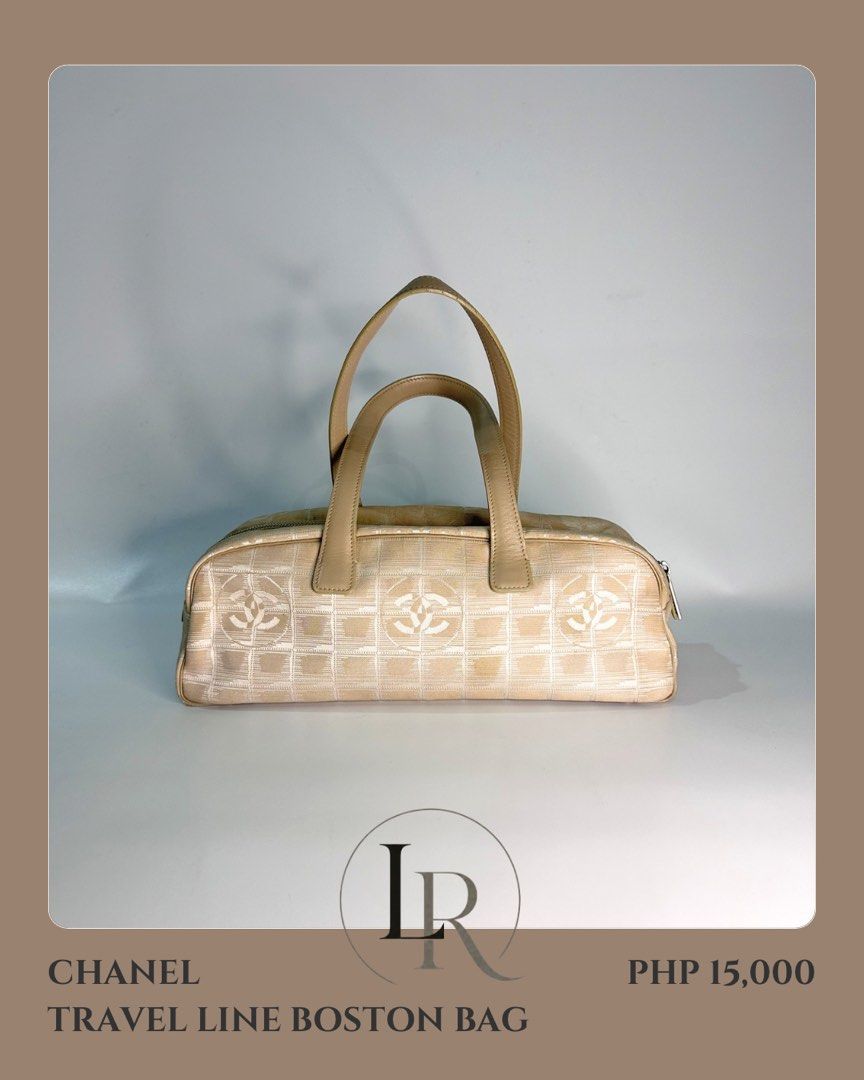 Chanel Travel Line Boston Bag (Category: Luxury Bags & Wallets) located in Quezon City. Submitted by elaine_t_dj (Listing ID 1442810466, Image 1). Description: - Authentic Chanel Travel Line Boston Bag - Color: Beige canvas with iconic CC logo pattern - Material: Durable canvas with genuine leather handles and trim - Closure: Secure zipper closure - Interior: Shows some signs of dirt - Hardware: Exhibits fading and scratches - Exterior: Light rub