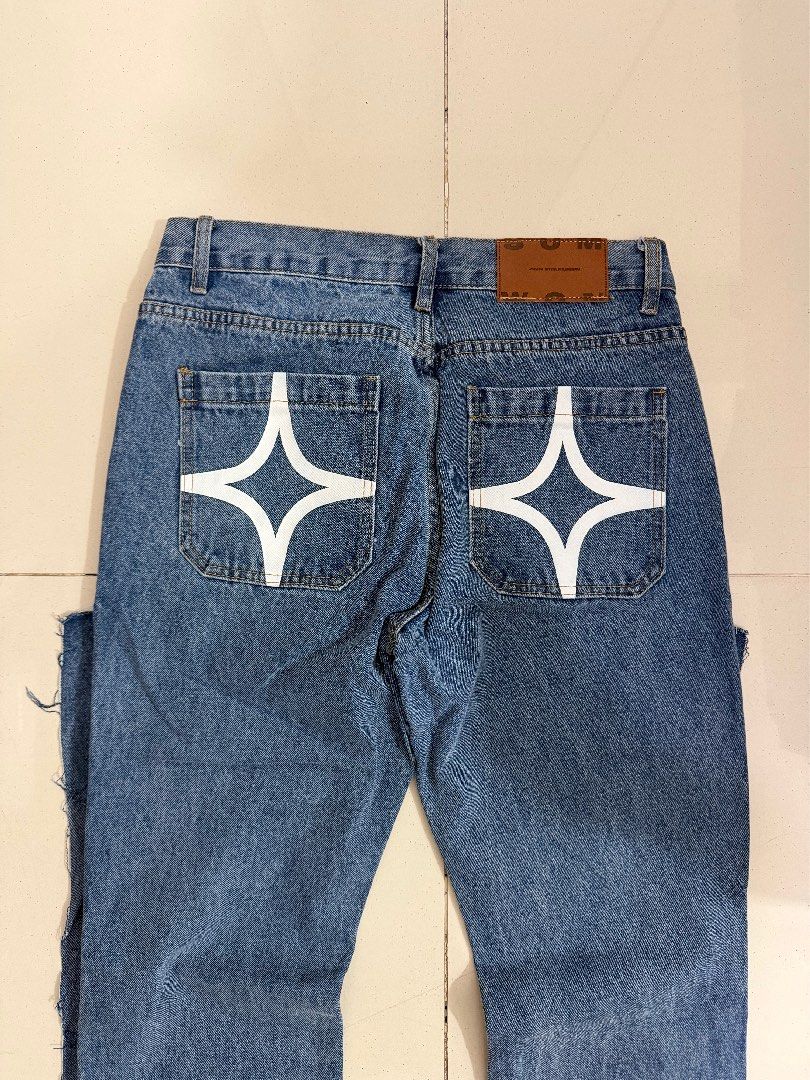 Flared Jeans with Star Print (Category: Jeans) located in Makati City. Submitted by thhird (Listing ID 1442899660, Image 3). Description: - Flared jeans with star print on legs and back pockets - Raw hem detail.