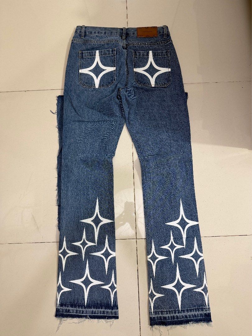 Flared Jeans with Star Print (Category: Jeans) located in Makati City. Submitted by thhird (Listing ID 1442899660, Image 1). Description: - Flared jeans with star print on legs and back pockets - Raw hem detail.