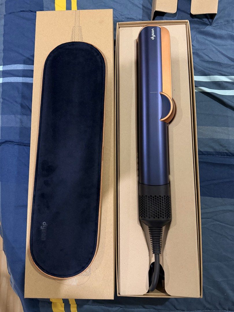 Dyson Airstrait Straightener Blue Copper (Category: Vision Care) located in Bacolod City. Submitted by ania.amarra (Listing ID 1442805053, Image 1). Description: - Dyson Airstrait Hair Straightener (Blue/Copper) - Revolutionary wet-to-dry technology for heat-free straightening - Achieve sleek styles quickly - Comes with original box, charging cable, and protective mat - Serial number clearly visible in photos.