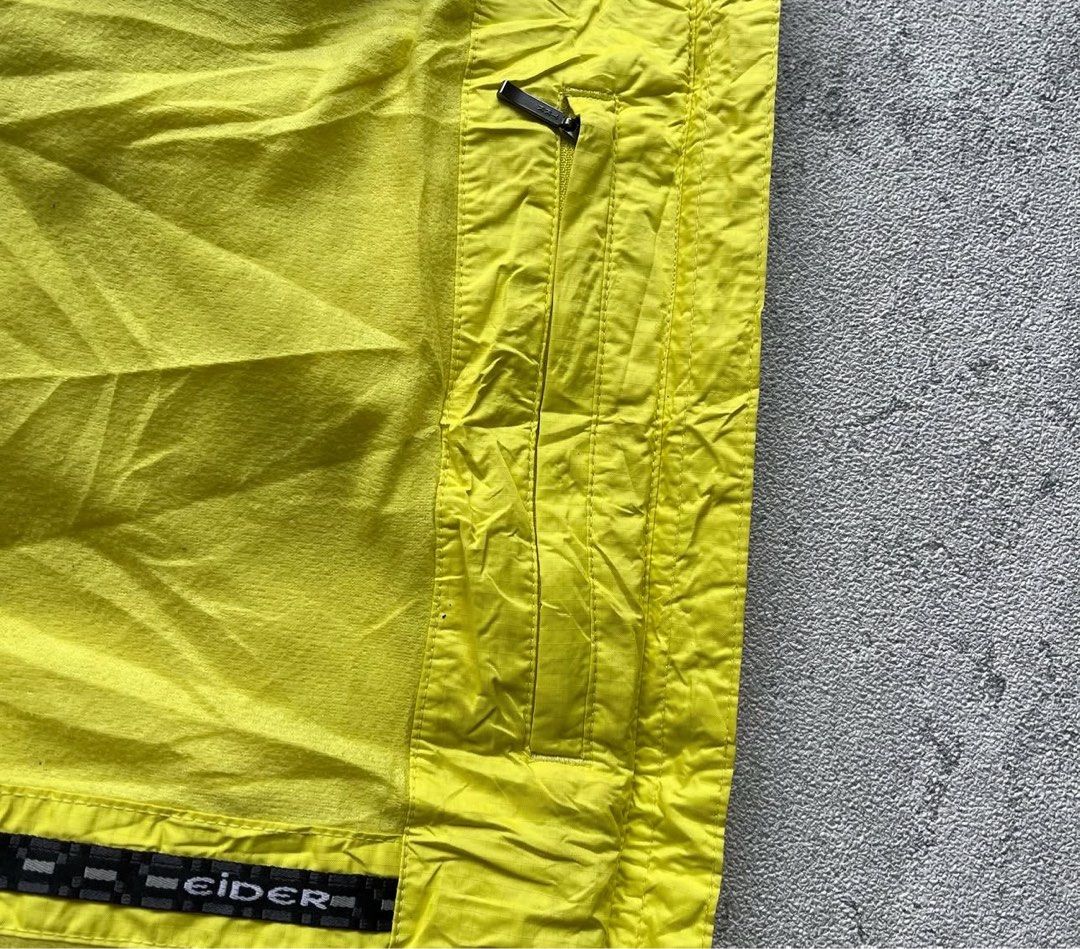 Eider technical shell jacket (Category: Coats, Jackets and Outerwear) located in Singapore. Submitted by sosleepyy (Listing ID 1442742947, Image 6). Description: (L 60 x W 48) * Technical waterproof shell * Pit/chest pocket * Adjustable hood * Alpine/mountaineering style cut * Bright yellow/black colorway.