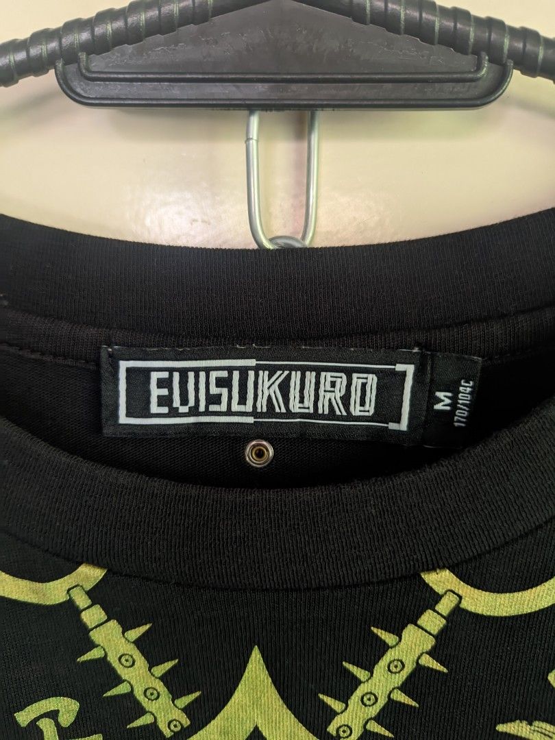 Evisukuro Black Graphic T-Shirt (Category: Tshirts & Polo Shirts ) located in Calapan. Submitted by ideals_06 (Listing ID 1442762826, Image 2). Description: - Black Evisukuro T-shirt - Size: Medium (M) - All-over graphic print - Central mandala-style design with intricate details - Short sleeves - Classic crew neck - Comfortable fabric - Refer to tag for care instructions.