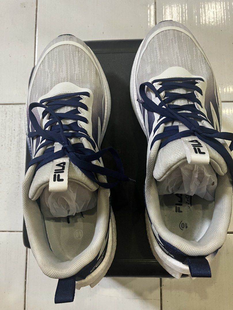 Fila Running Shoes WHTGRY 70 (Category: Sneakers) located in Manila. Submitted by cramlcia01 (Listing ID 1442739914, Image 2). Description: - Fila Running Shoes - Size: 10 - Original Price: P2,499 - Ideal for running or everyday wear .