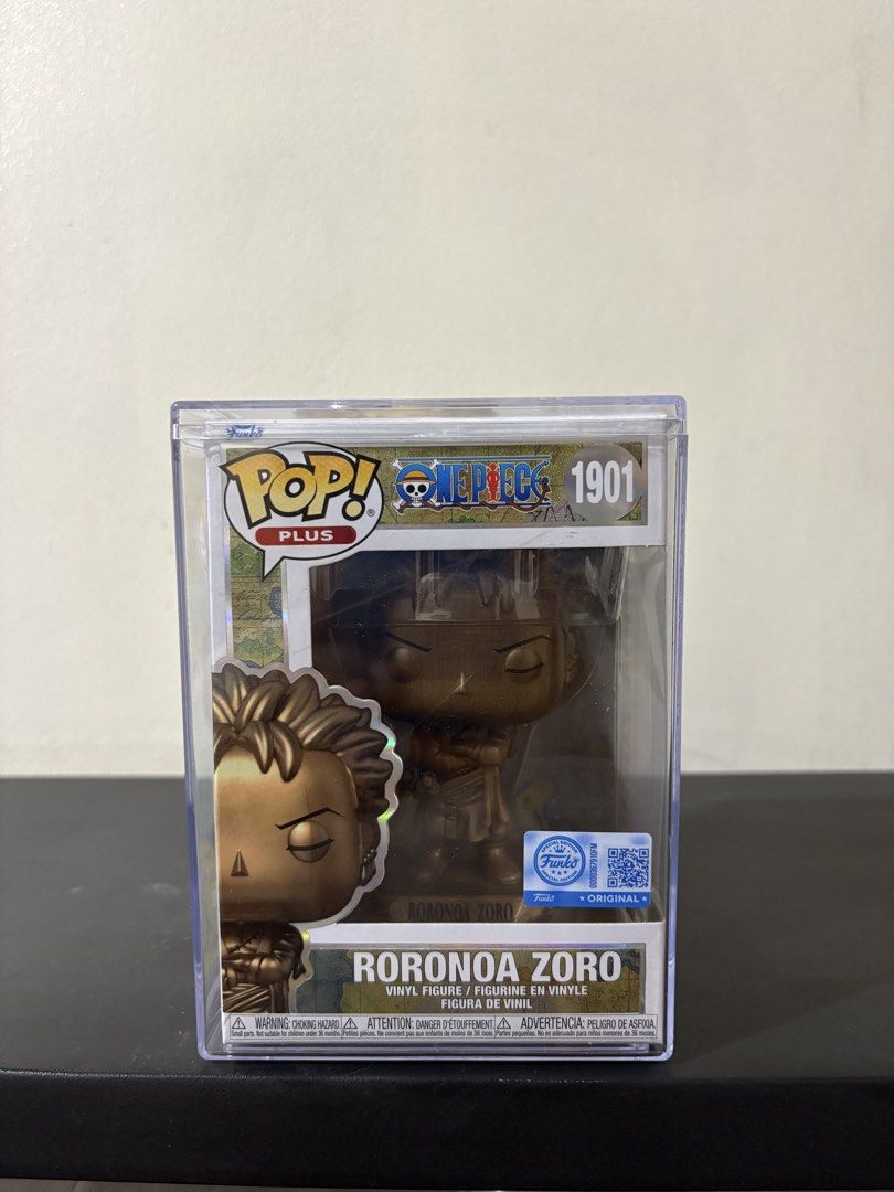 Funko Pop! One Piece Roronoa Zoro Bronze Statue (Category: Figurines & Statues) located in Guagua. Submitted by pop.vault (Listing ID 1442796736, Image 1). Description: - Funko Pop! Roronoa Zoro (Figure #1901) - Exclusive Gold Variant - From the popular anime series One Piece - Includes original protective case - Ideal for any One Piece fan's collection.