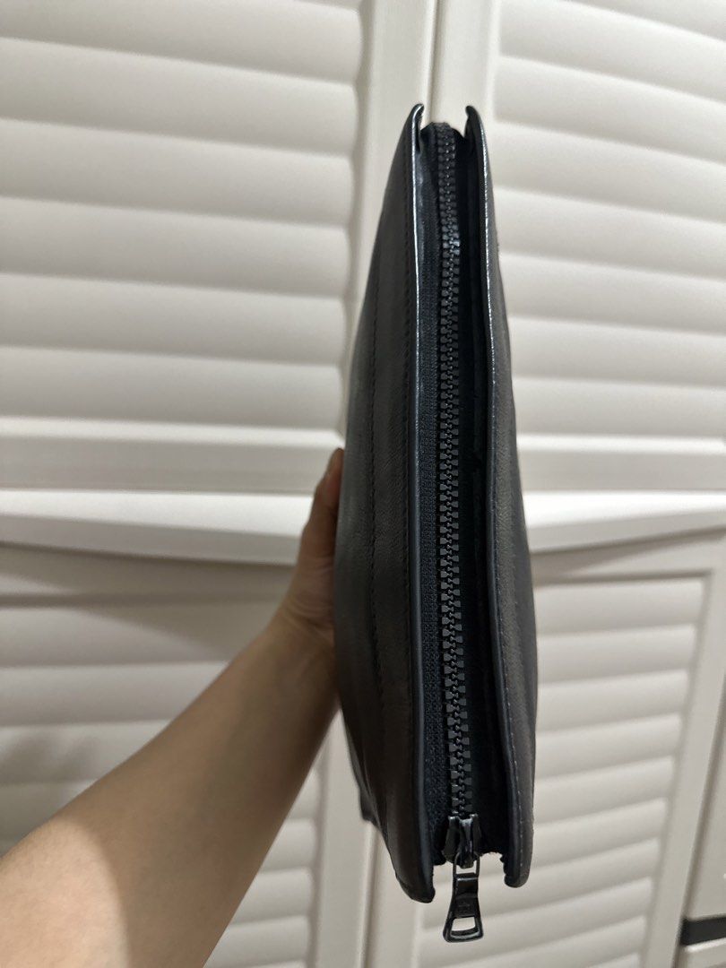 Givenchy Black Leather Logo Clutch Pouch (Category: Luxury Bags & Wallets) located in Naga. Submitted by bag.net (Listing ID 1442880244, Image 3). Description: - Authentic Givenchy black leather clutch (moneyback guaranteed 💯 if proven fake) - Features iconic embossed square logo on the front - Secure zip closure - Sleek and simple design - Ideal for carrying your daily essentials From Japan.