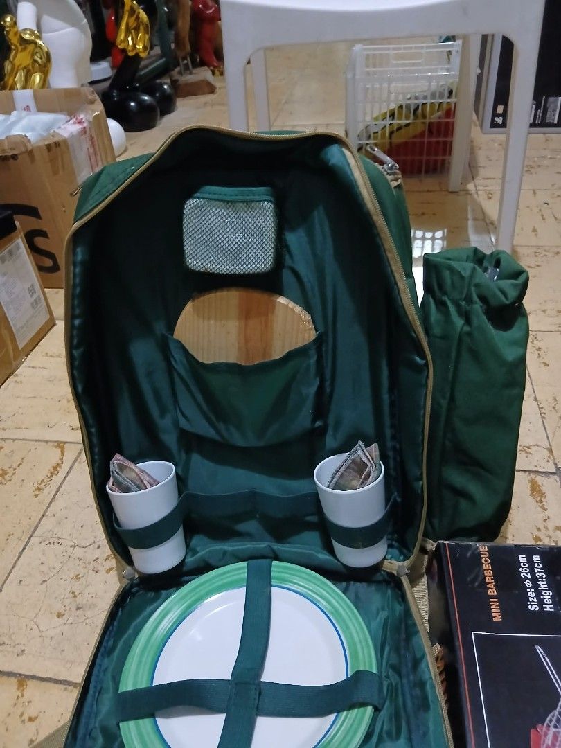 Green Picnic Backpack Set with Utensils and Plates (Category: Hiking & Camping) located in Manila. Submitted by machixsham76357 (Listing ID 1442835015, Image 1). Description: - All-in-one picnic backpack for your outdoor meals. - Includes plates, cups, and cutlery for convenient dining. - Features a mini barbecue grill for grilling on the go. - Ideal for picnics, camping, and beach outings. - Your perfect companion for your next adventure..