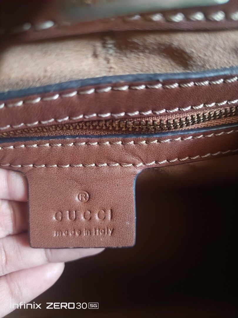 Gucci Brown Leather Handbag with Gold Lock (Category: Luxury Bags & Wallets) located in Manila. Submitted by feliajenny76751 (Listing ID 1442768995, Image 2). Description: - Genuine brown leather Gucci handbag - Elegant gold lock closure - Interior zipper pocket for essentials - Authenticity guaranteed: Made in Italy - Serial number: 453188 2988 -Gucci Under Zip -With Etiketa.