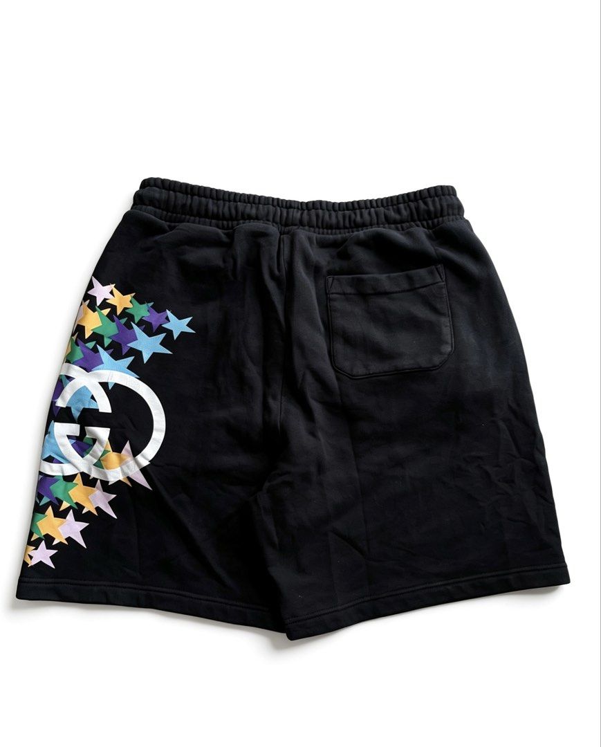 GUCCI INTERLOCKING G STAR FLASH PRINT HEAVY COTTON SHORT (Category: Shorts) located in Caloocan City. Submitted by jerichotad22965 (Listing ID 1442808218, Image 2). Description: - Authentic Gucci shorts - Size L - Iconic GG logo with colorful stars - Elastic waistband with drawstring - Zipper pocket on the side - Back pocket detail - Made in Italy -Hairline -Cracks on print .