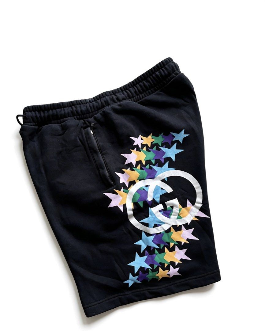 GUCCI INTERLOCKING G STAR FLASH PRINT HEAVY COTTON SHORT (Category: Shorts) located in Caloocan City. Submitted by jerichotad22965 (Listing ID 1442808218, Image 1). Description: - Authentic Gucci shorts - Size L - Iconic GG logo with colorful stars - Elastic waistband with drawstring - Zipper pocket on the side - Back pocket detail - Made in Italy -Hairline -Cracks on print .